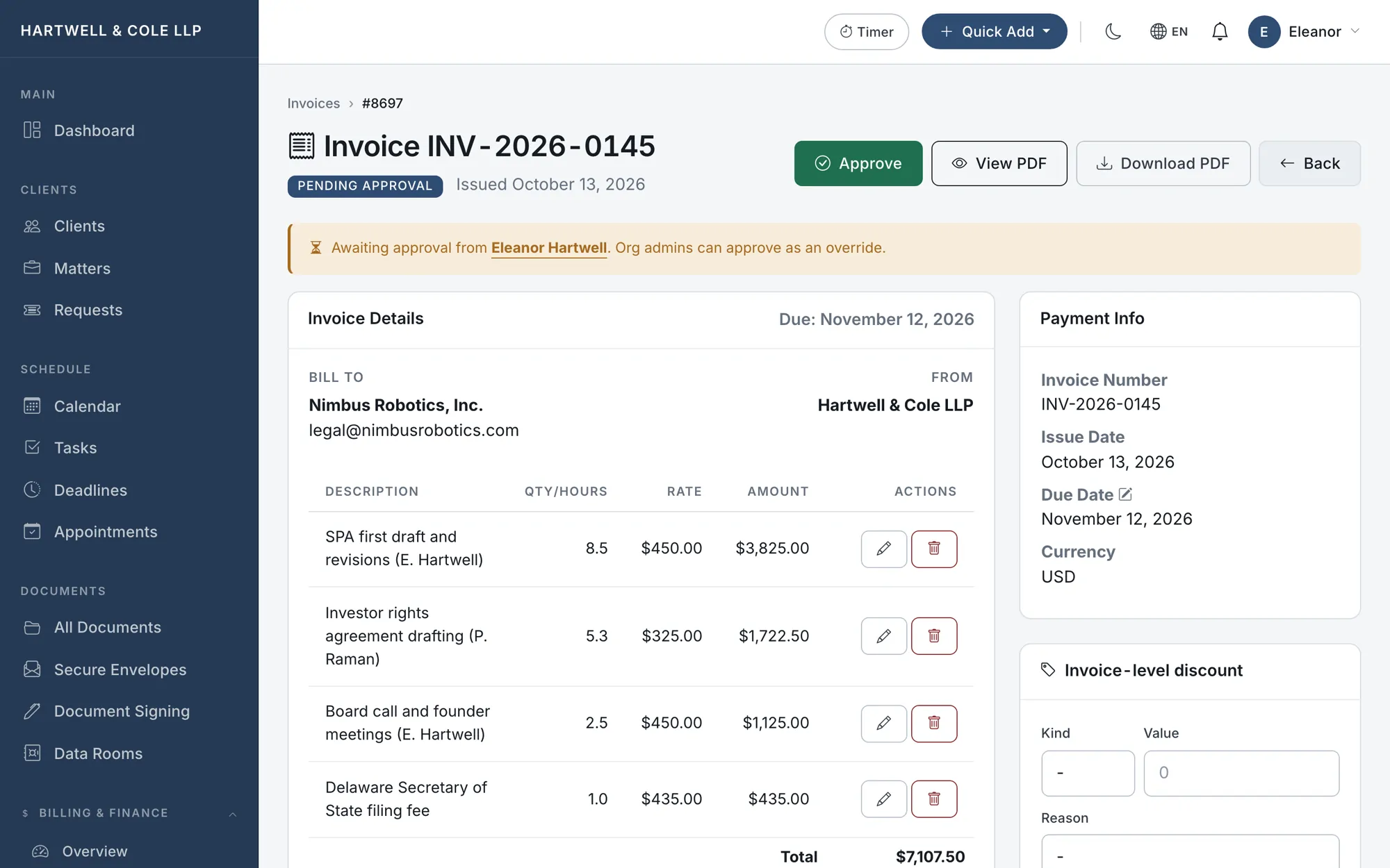 An invoice in pending-approval state with line items pulled from time entries and an Approve button